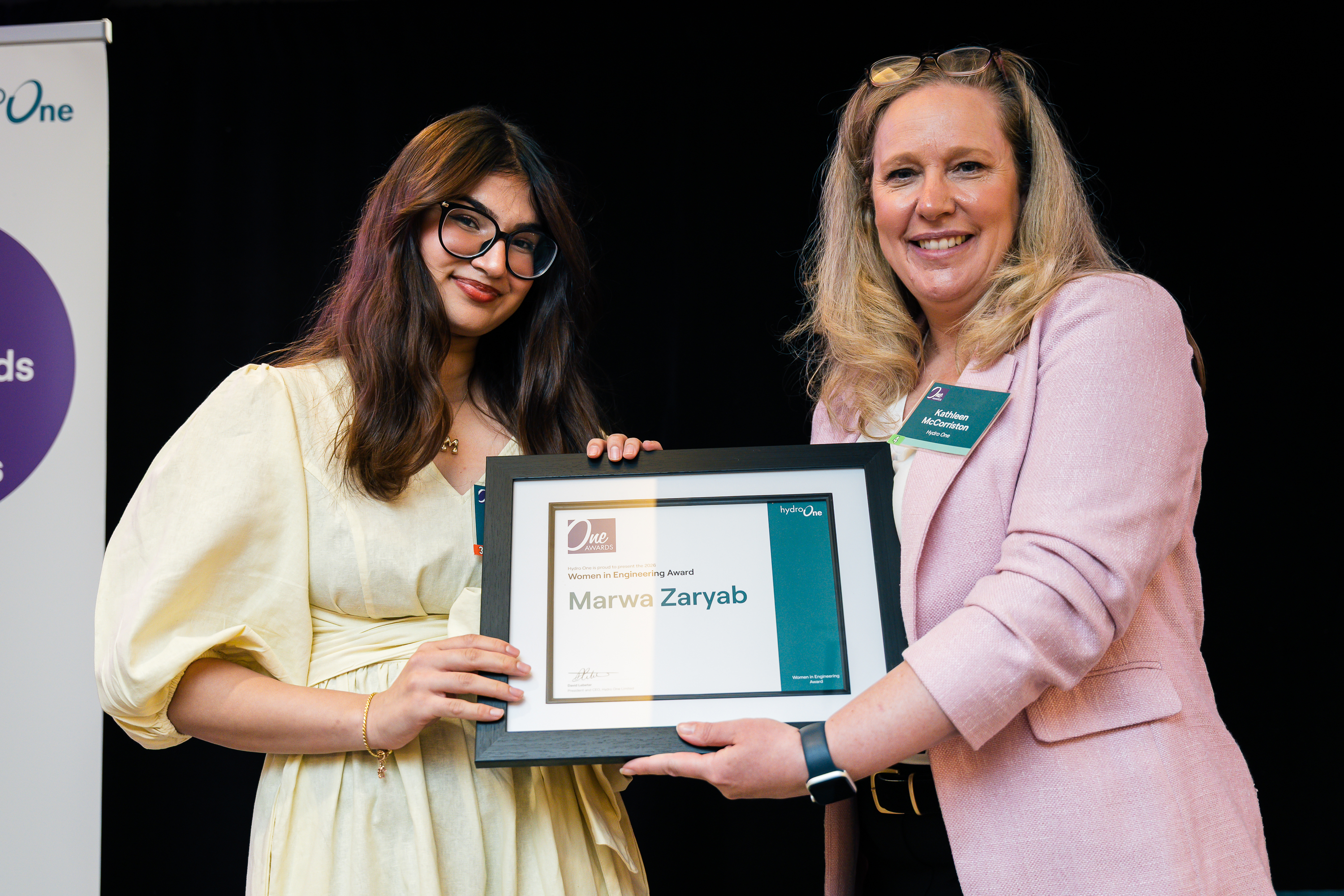Marwa receiving an award